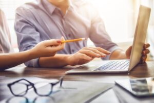 man and woman working in the office